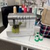 Used Janome CoverPro 3000 Professional coverstitch machine at Glory Bee's Sewing Center