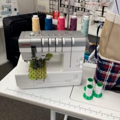 Used Janome CoverPro 3000 Professional coverstitch machine at Glory Bee's Sewing Center
